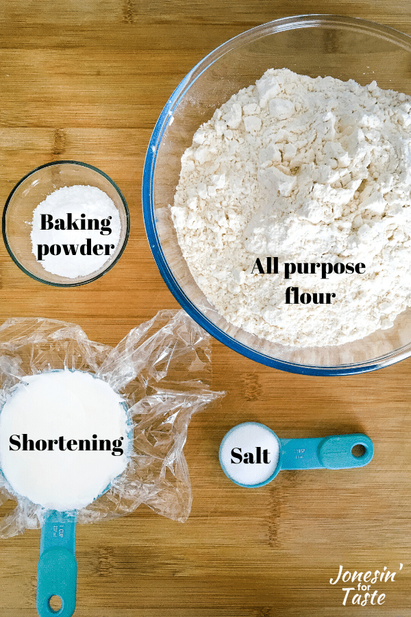 flour, salt, baking powder, and shortening on a wooden cutting board