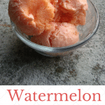 scoops of watermelon ice cream in a glass bowl