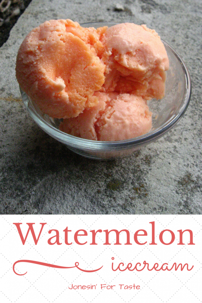 Three scoops of watermelon ice cream in a glass bowl