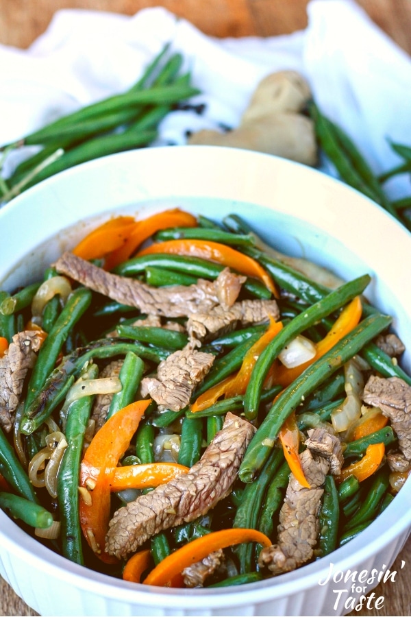 A serving dish with Cantonese Style Black Pepper Beef and green beans