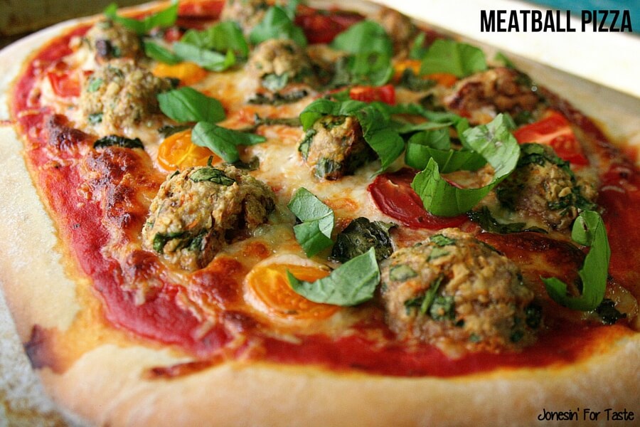 A meatball pizza on a cookie sheet