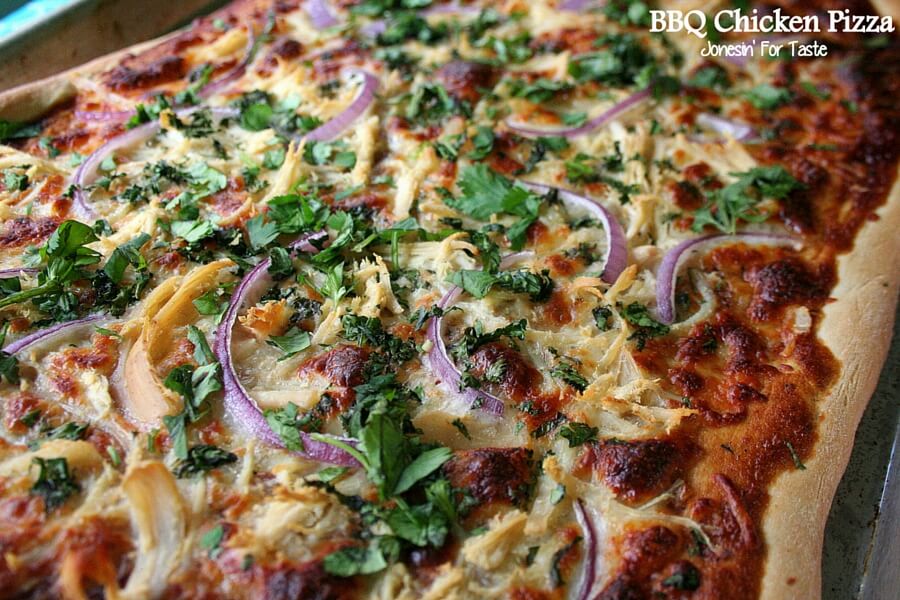 BBQ Chicken pizza topped with red onion and cilantro.