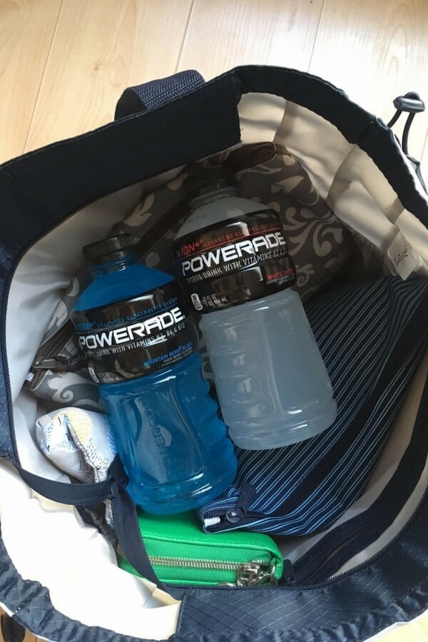 two bottles of powerade in a diaper bag