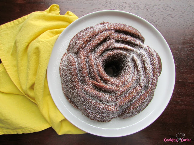 A beautiful rose shaped easy banana bundt cake dusted with powdered sugar