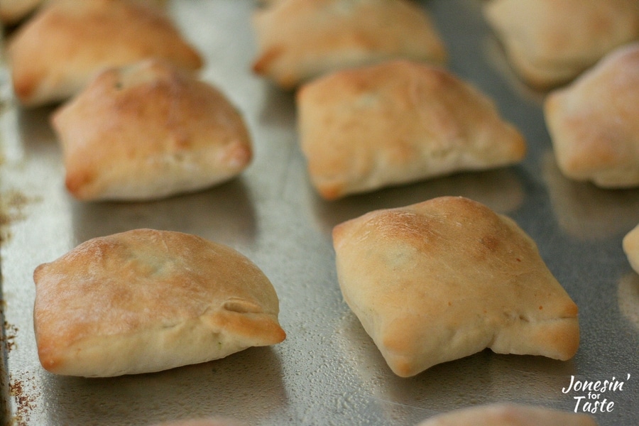 Easy Mini Spinach Calzones on a baking sheet.