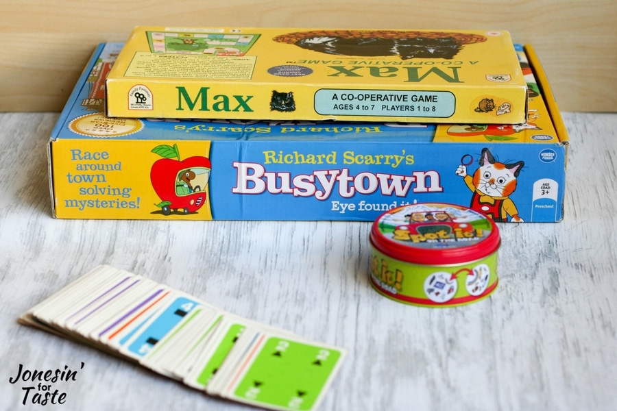 Showing a few board games for family game night for younger children in a small stack