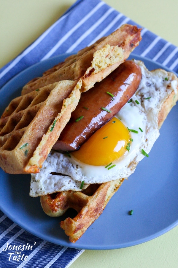 Cornmeal waffle sandwich with meat and egg