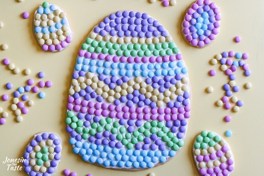 An Easter Egg cookie pizza with several mini Easter egg cookies