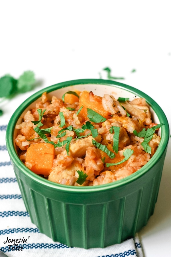 green bowl with chicken, rice, and butternut squash