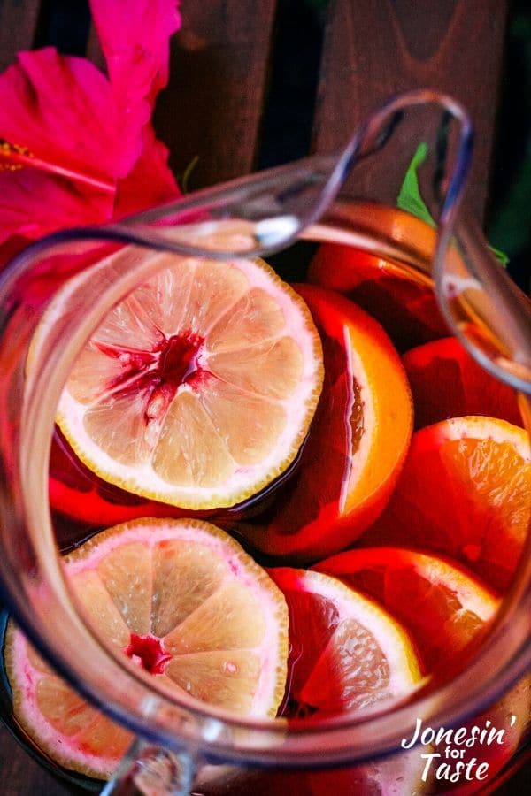 citrus slices in a pitcher with the juice